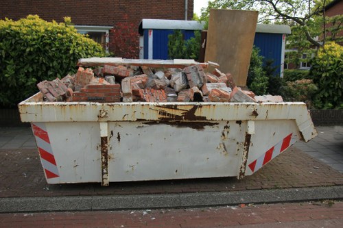 Construction site with builders removing waste in Paddington