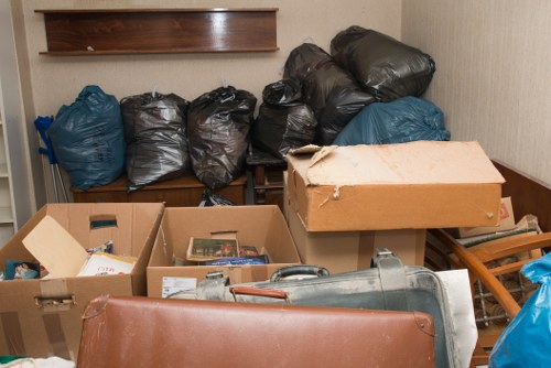 Overview of sorted recyclables and reusable office items ready for donation